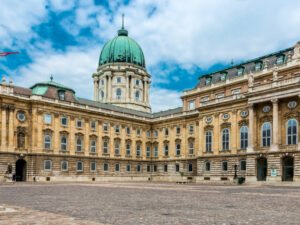 Buda Castle exterior with its grand dome and intricate facade in Budapest’s historic district.