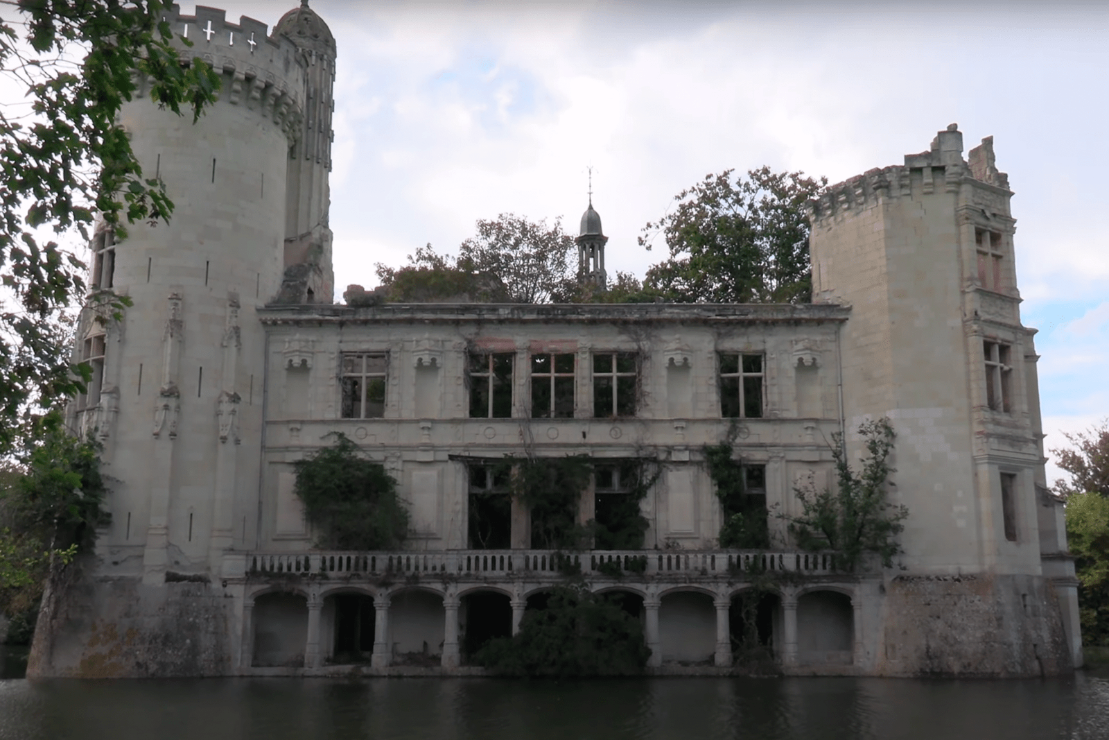 Façade of la Mothe-Chandeniers Reflected in Its Moat