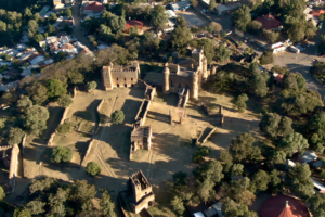 Aerial photo of the entire Fasil Ghebbi royal enclosure in Gondar, Ethiopia, showing the castle’s walled layout, towers, and surrounding urban area.