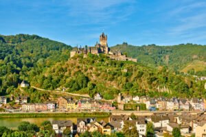 Cochem Castle overlooking the colorful town and Moselle River in Germany