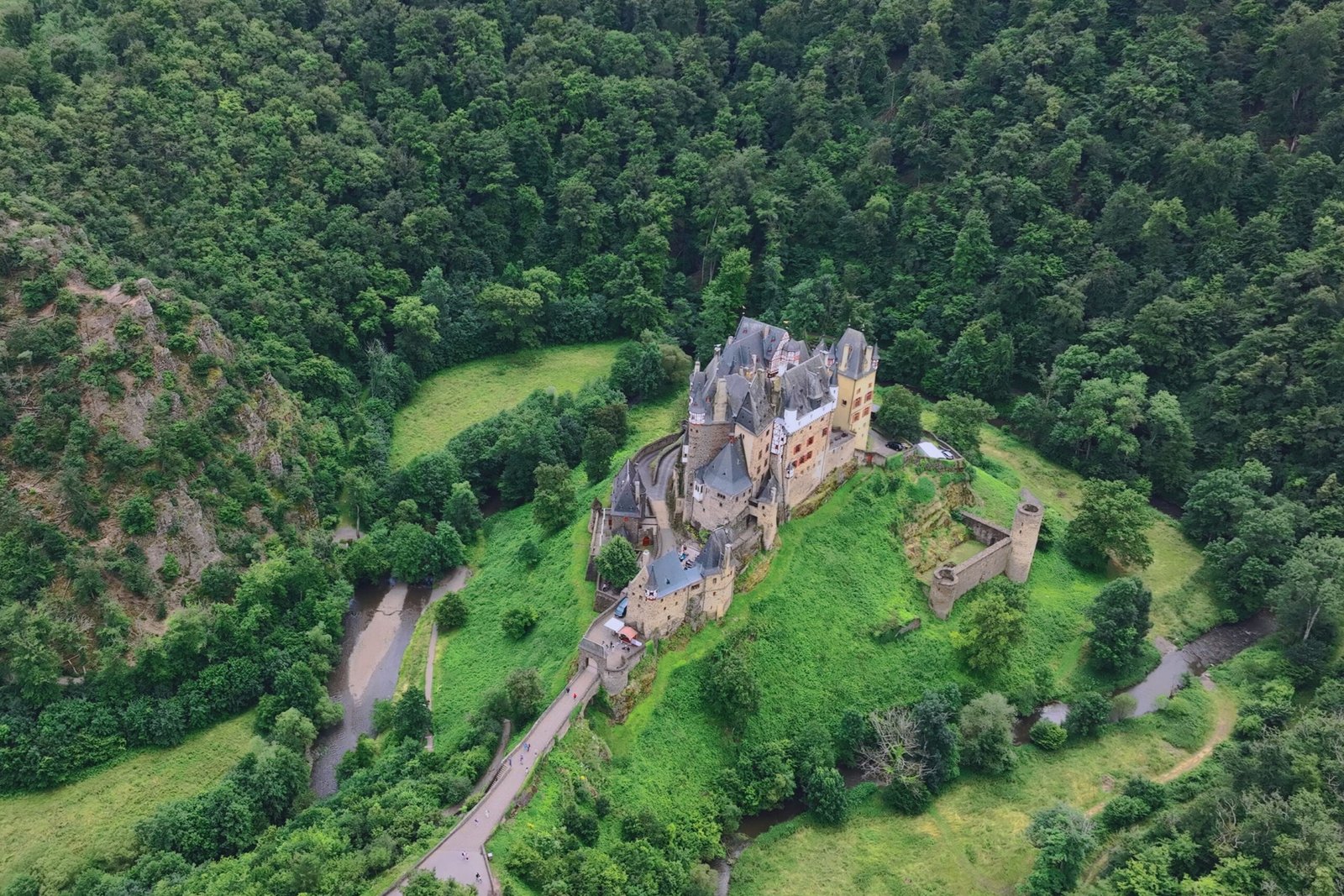 Aerial Perspective of Eltz Castle in Its Forested Valley