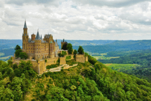 Aerial view of Hohenzollern Castle on a lush hilltop in Germany