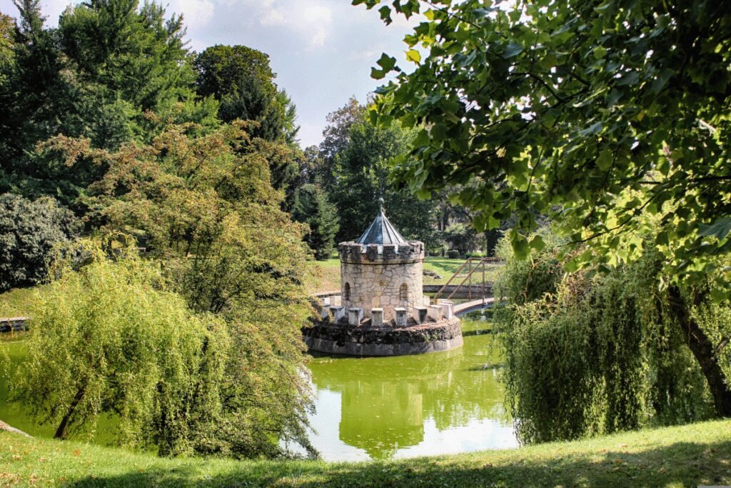 Stone moat tower surrounded by trees at Bojnice Castle in Slovakia