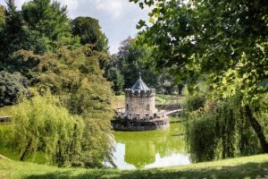 Stone moat tower surrounded by trees at Bojnice Castle in Slovakia
