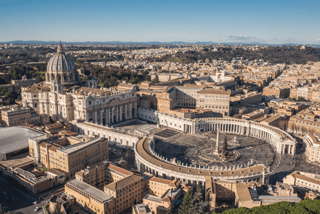 Aerial view of Vatican City and St. Peter’s Square bathed in sunlight.