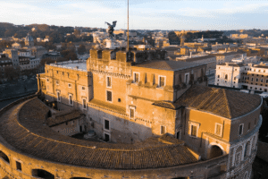 Aerial view of Sant'Angelo Castle in Rome at sunset.