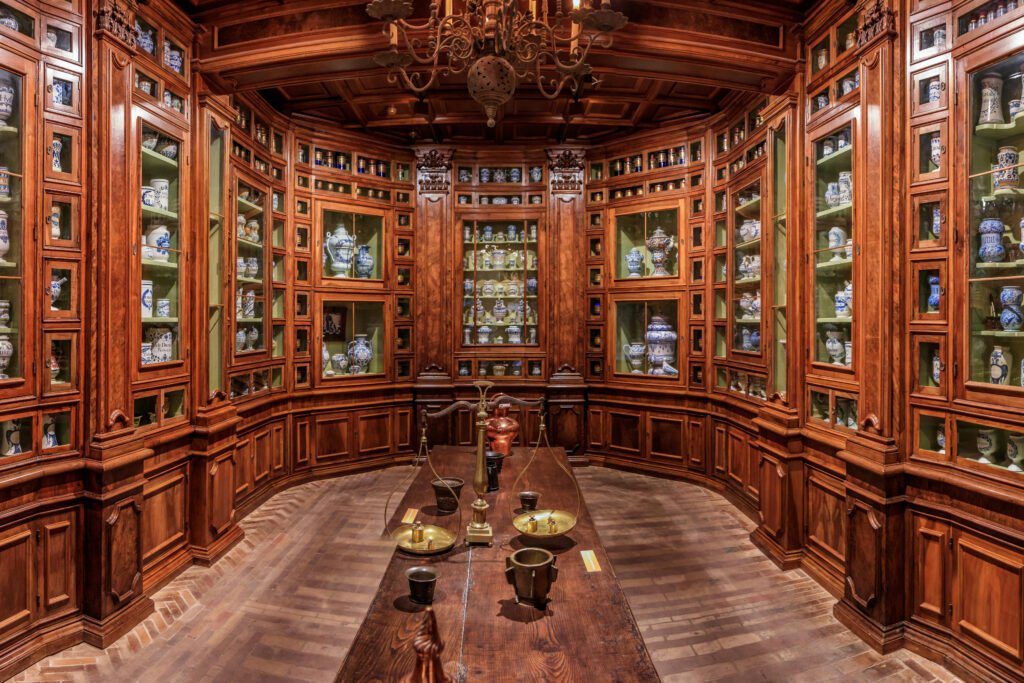 Castle pharmacy with jars, wooden cabinets, historic interior in Heidelberg Castle.