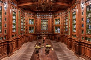 Castle pharmacy with jars, wooden cabinets, historic interior in Heidelberg Castle.