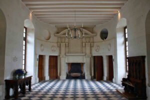Elegant hallway with checkered floor at Château de Chenonceau