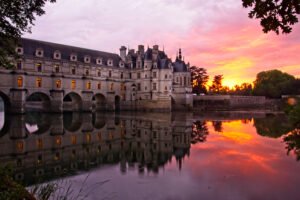 Château de Chenonceau reflected on river at sunset