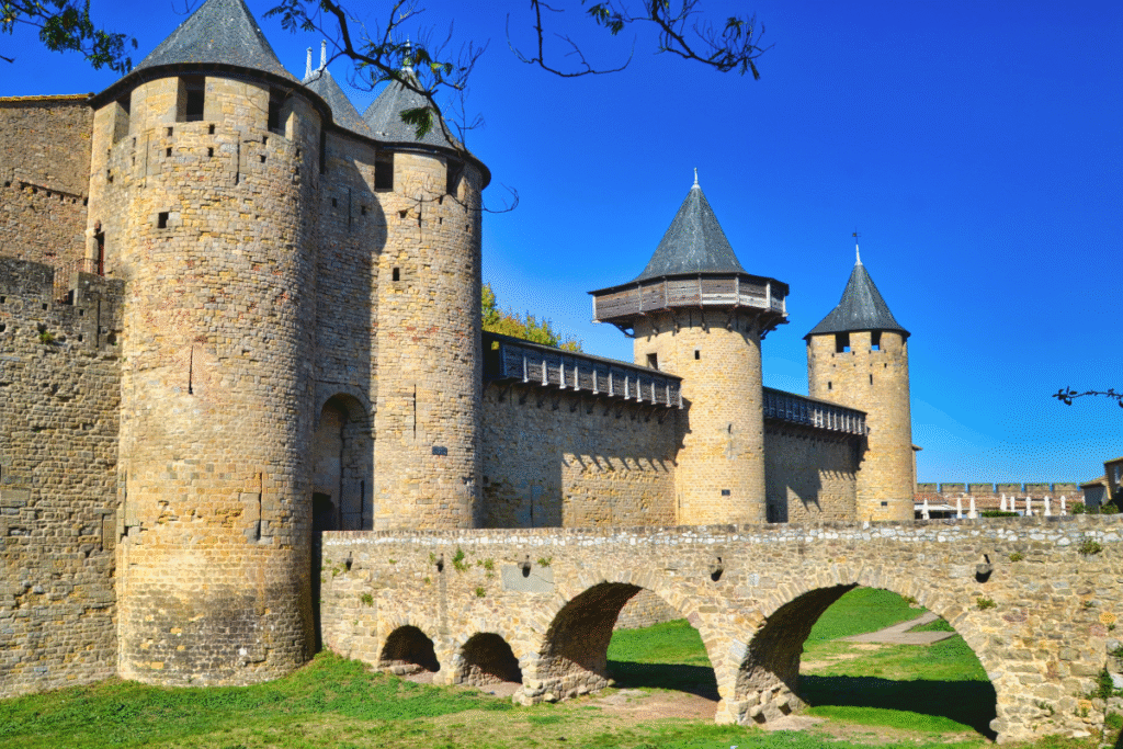 Carcassonne Castle stone towers and bridge under blue sky