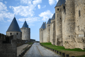 Carcassonne castle walls and towers under blue sky, medieval fortress in France.