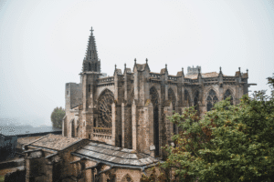 Carcassonne Castle side view, medieval architecture, magnificent gothic style, on a misty day in France.