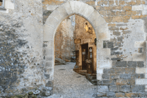 Stone archway and medieval street in Carcassonne Old Town