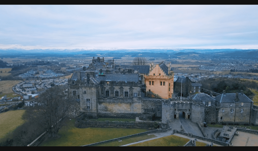 Aerial view of Stirling Castle with Scottish landscape surrounding the historic fortress.