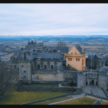 Aerial view of Stirling Castle with Scottish landscape surrounding the historic fortress.