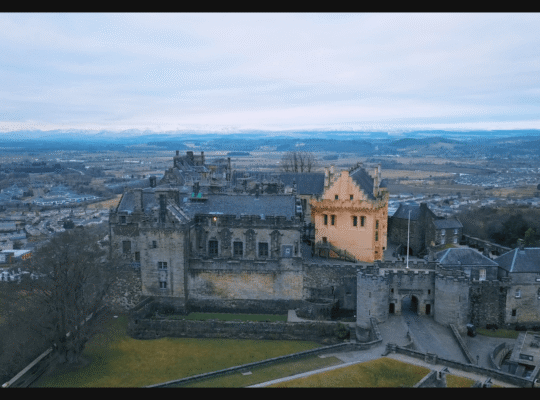 Aerial view of Stirling Castle with Scottish landscape surrounding the historic fortress.