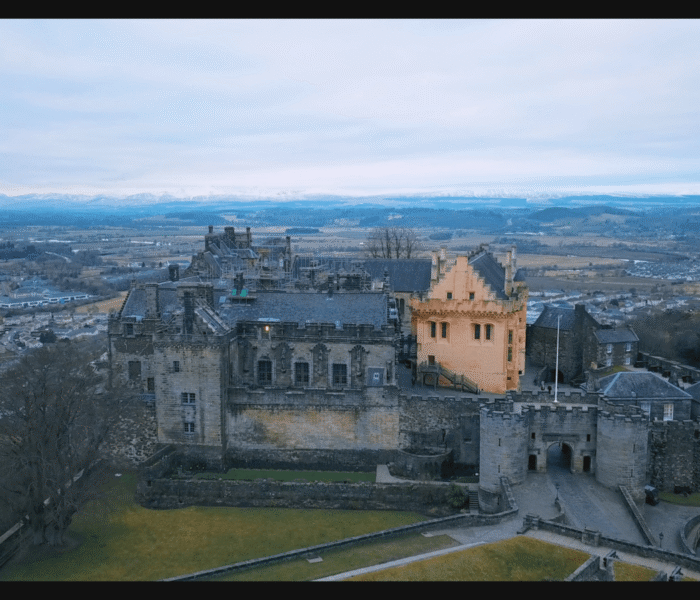 Aerial view of Stirling Castle with Scottish landscape surrounding the historic fortress.