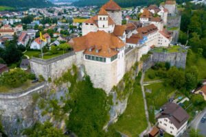 Aerial view of Aarburg Castle perched on limestone cliff above town