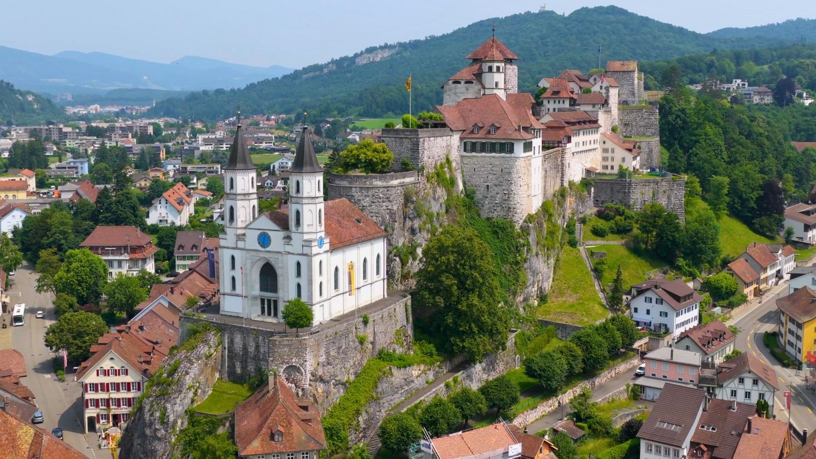 Aarburg Castle atop rocky hill with church and town below