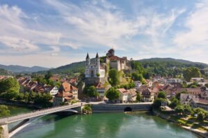 Aarburg Castle on rocky hill above Aare River and town