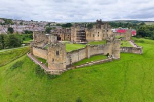 Aerial view of Alnwick Castle and surrounding green ramparts