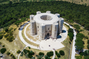 Aerial photo of Castel del Monte’s octagonal fortress amid Apulia’s countryside in southern Italy.
