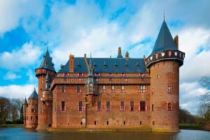 Castle De Haar overlooking reflective moat and towers