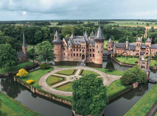 Aerial view of Castle De Haar surrounded by moat and gardens