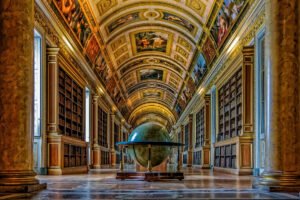 Vaulted library hall with globe at Versailles