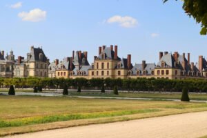 Façade of Château de Fontainebleau across formal gardens