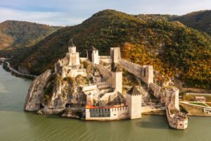 Aerial view of Golubac Fortress on rocky Danube cliff