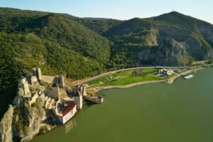 Aerial view of Golubac Fortress on riverbank