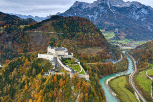 Aerial view of Hohenwerfen Castle overlooking the Salzach River and autumn Alps near Werfen, Austria.