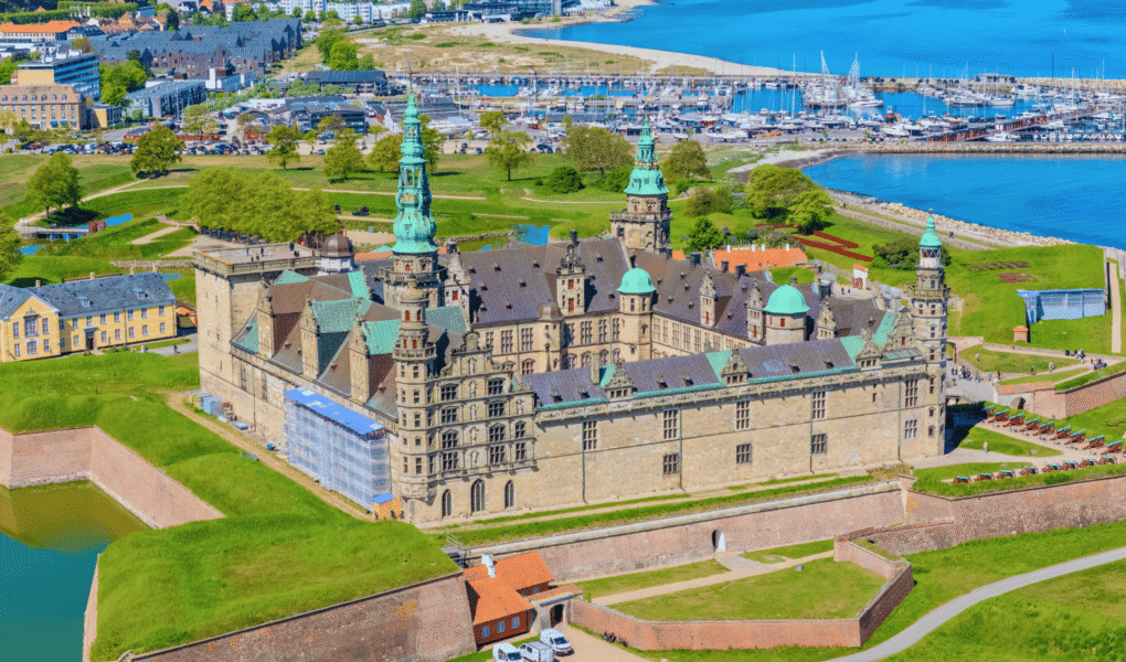 Aerial view of Kronborg Castle in Helsingør, Denmark, beside the marina and Øresund coast.