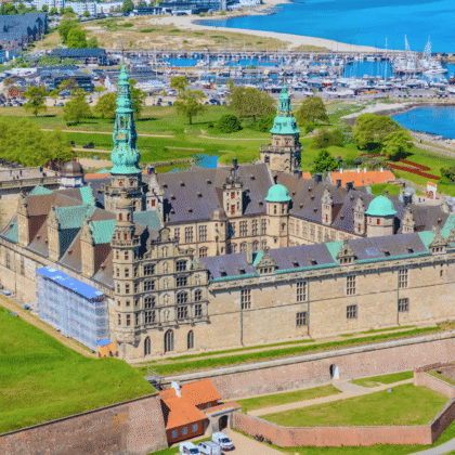 Aerial view of Kronborg Castle in Helsingør, Denmark, beside the marina and Øresund coast.