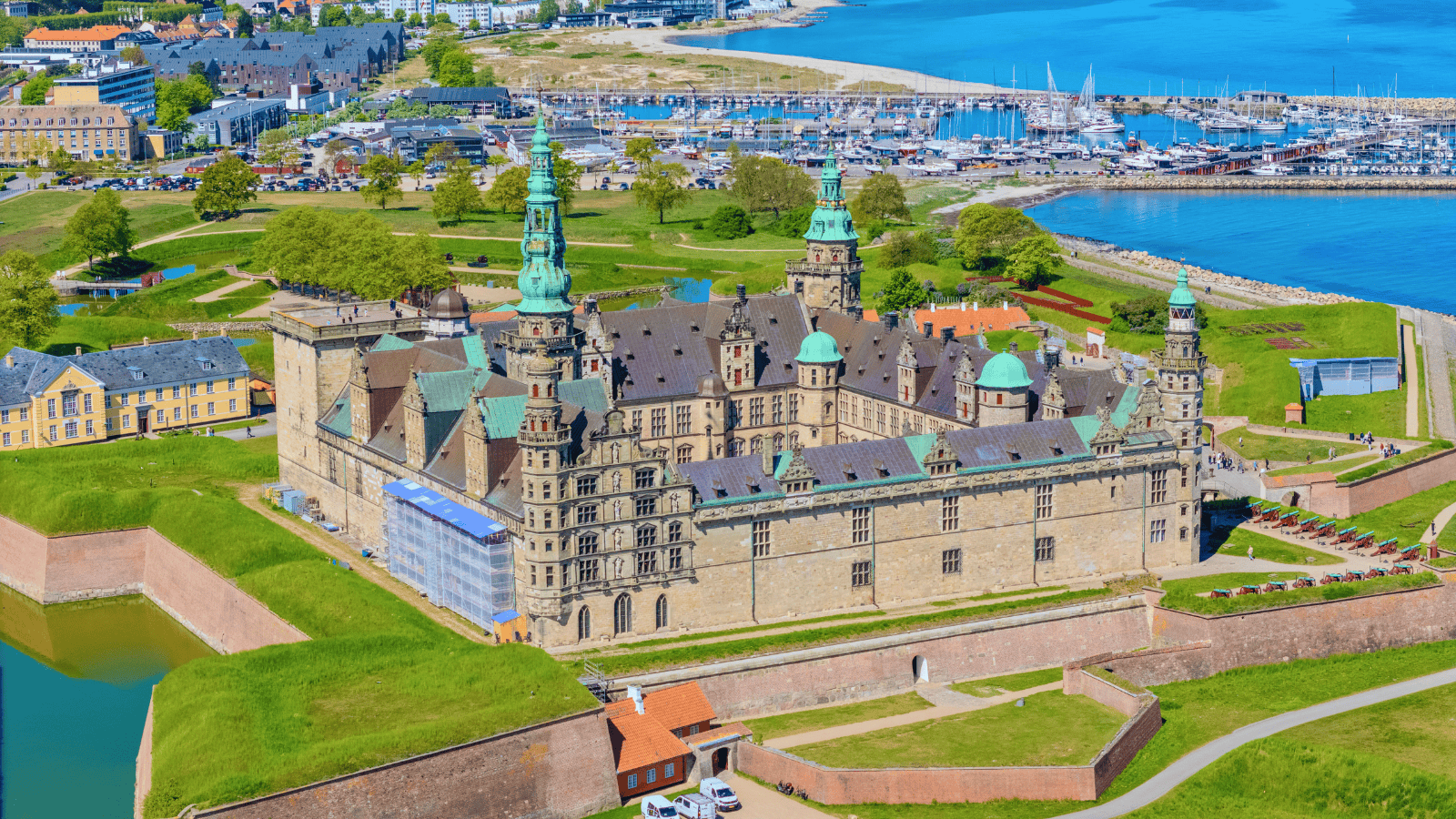 Aerial view of Kronborg Castle in Helsingør, Denmark, beside the marina and Øresund coast.