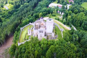 Aerial view of Landštejn Castle surrounded by forest
