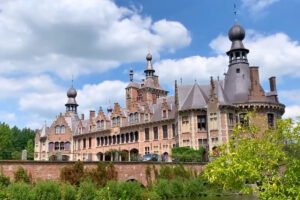 Ooidonk Castle beside moat and manicured gardens