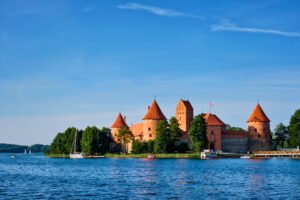 Trakai Island Castle on Lake Galvė under blue sky.