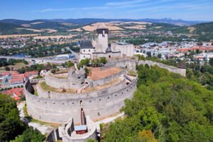 Aerial view of Trenčín Castle towering above town and river