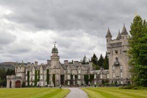 Balmoral Castle façade under dramatic grey clouds