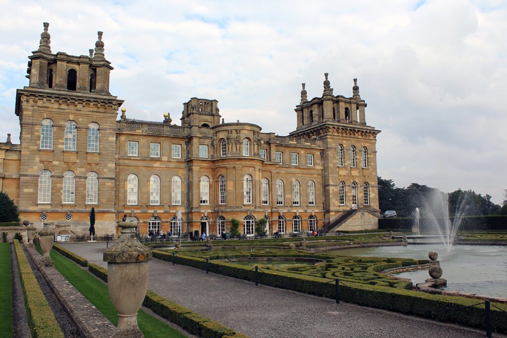 Blenheim Palace facade with formal gardens and fountain