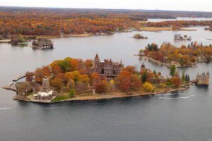 Aerial view of Boldt Castle on Heart Island surrounded by autumn foliage