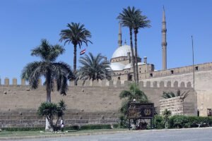 Cairo Citadel walls, palm trees and domed Muhammad Ali Mosque