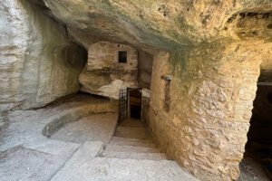 Stone steps and doorway inside Castello bizantino di Angelokastro cave interior
