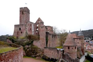 Ruined red-sandstone Castle Wertheim walls and towers above town and river