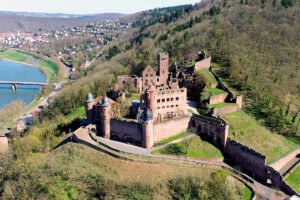 Aerial view of Castle Wertheim perched above river and town