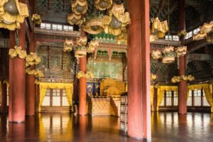 Interior view of Changdeokgung Palace throne hall with golden canopy