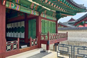 Changdeokgung Palace wooden pavilion with colorful painted eaves and lattice doors